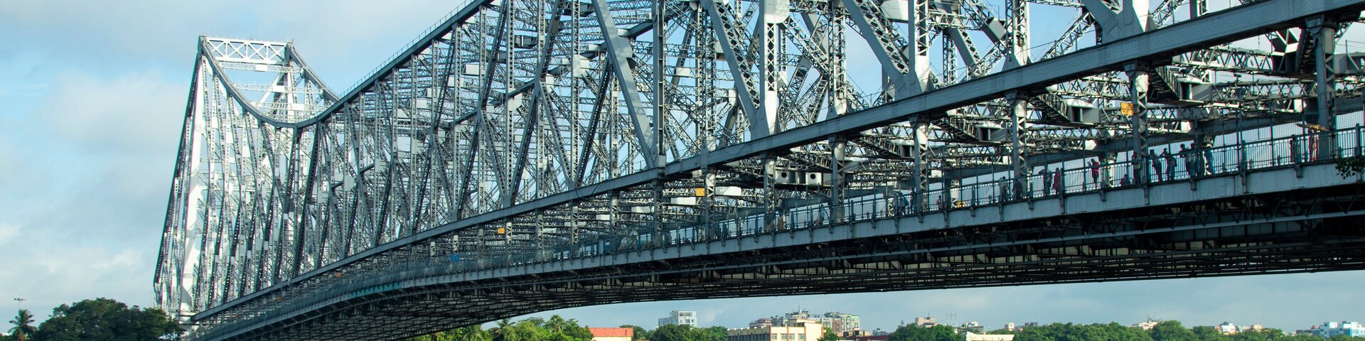iconic Howrah bridge or Rabindra Setu of Kolkata and boat in river Ganges
