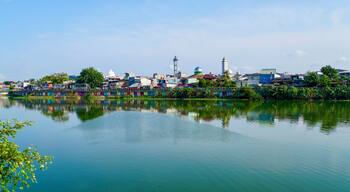 The calm waters at Sunter Lake in Jakarta, Indonesia, reflect the vast blue sky above