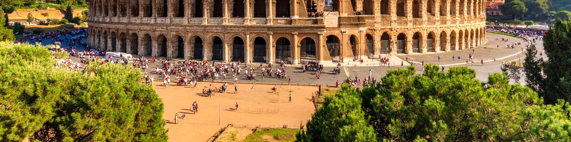 The Colosseum in Rome with tourists around.