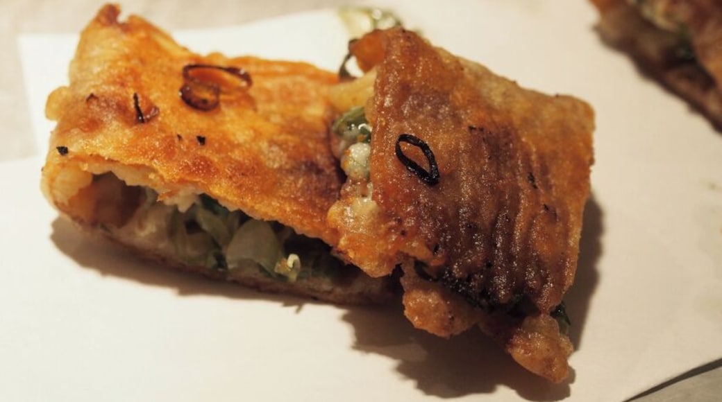 Fried Squid with Mayo, cooked right in front of you at Inishina, a quiet teppanyaki restaurant in Shibuya. The okonomiyaki is their speciality, but I recommend visiting more than once to enjoy all of the izakaya style small plates. The Fried Chicken Skin is particularly tasty.