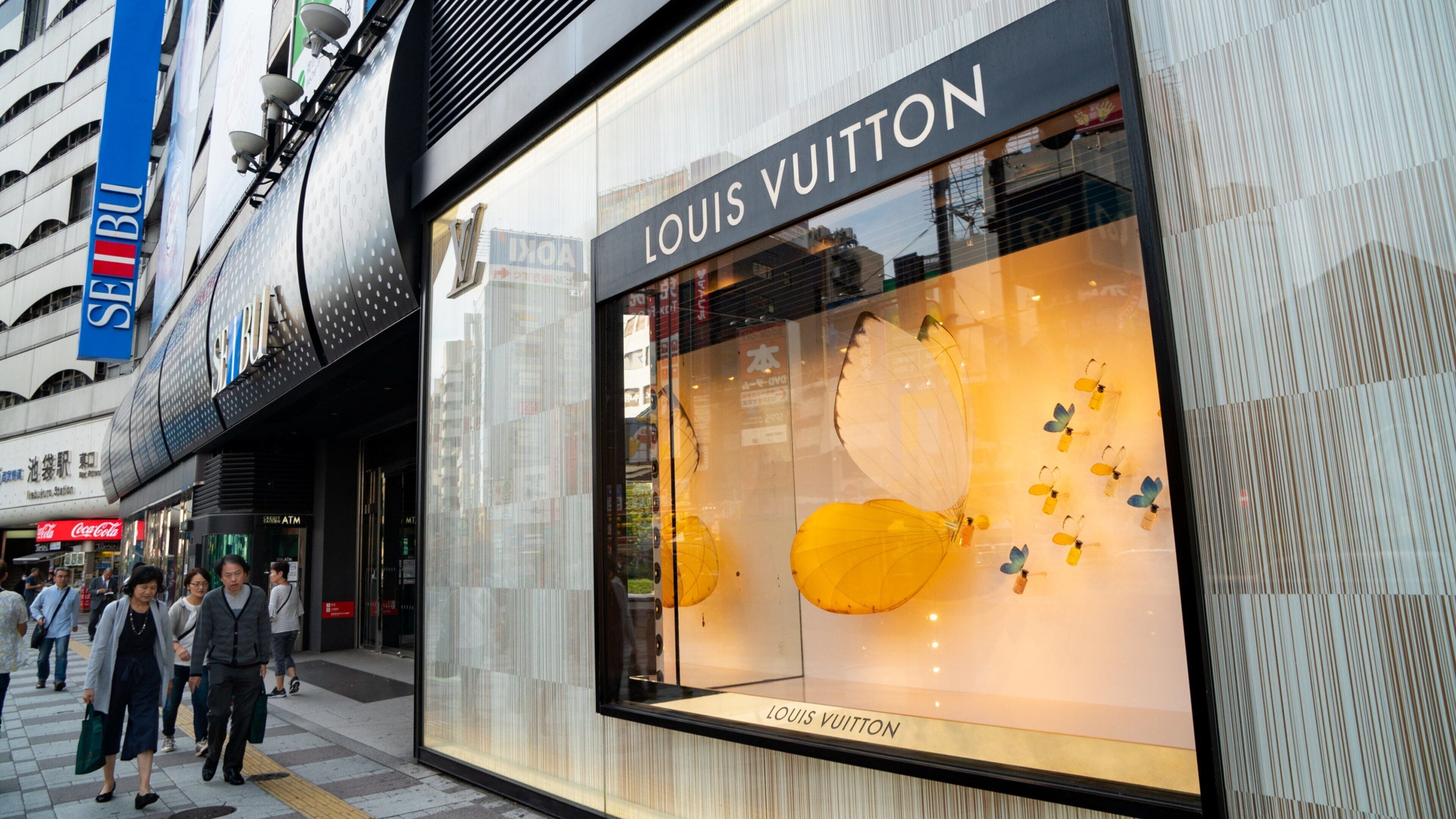 Toshima which includes signage and street scenes