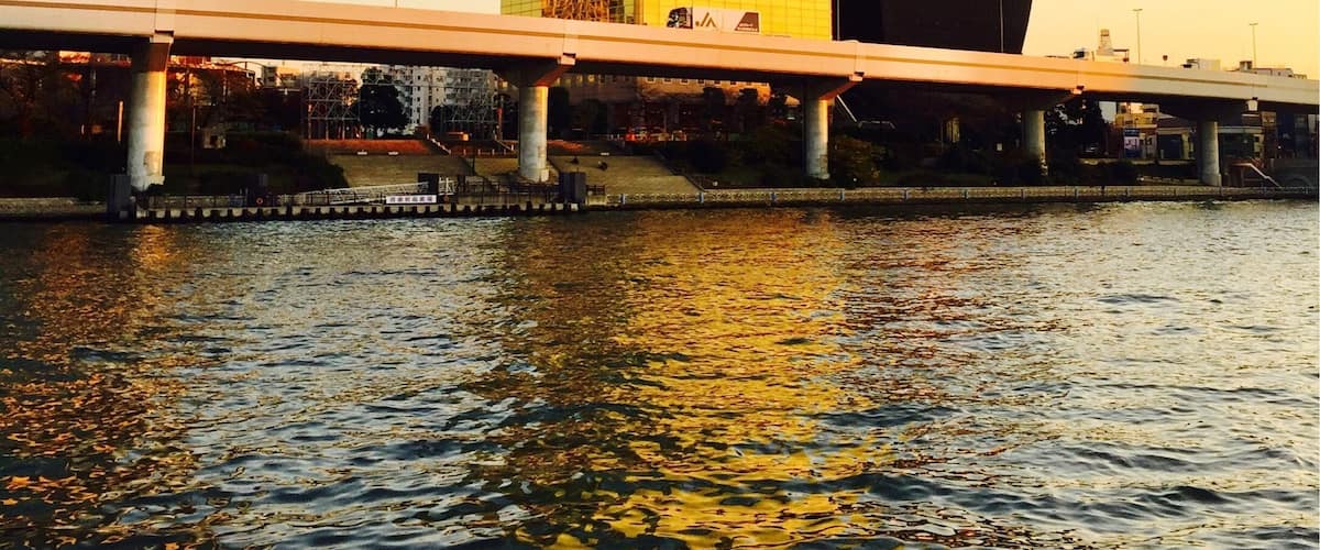 Tokyo Skytree reflected in Asahi's Headquarters on the Sumida River