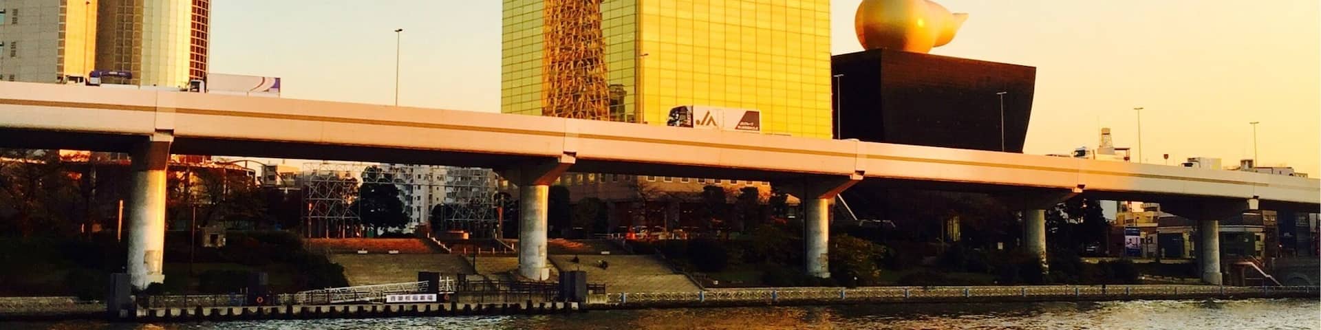 Tokyo Skytree reflected in Asahi's Headquarters on the Sumida River