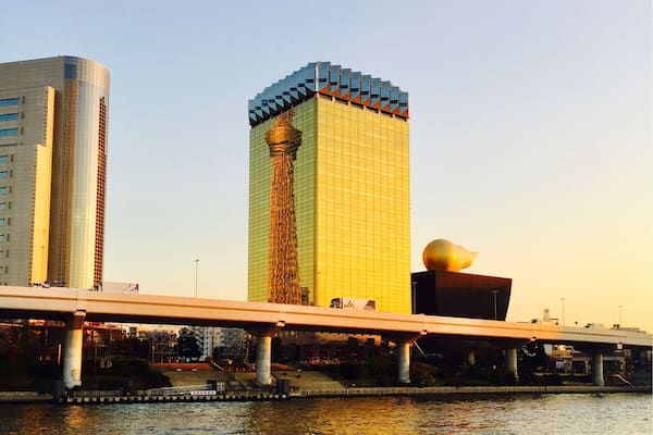 Tokyo Skytree reflected in Asahi's Headquarters on the Sumida River