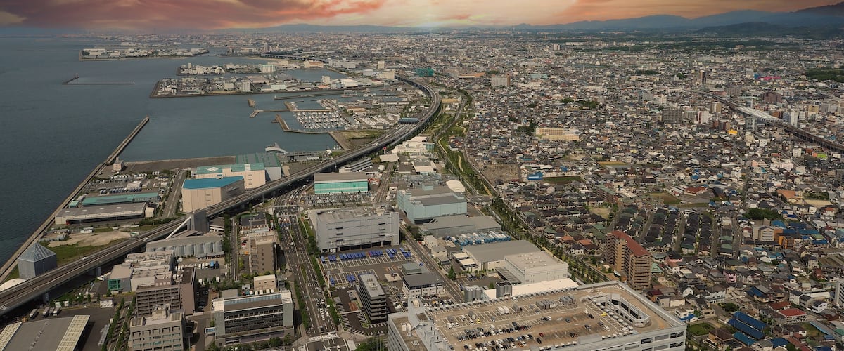 Aerial view or bird eyes view images of Kansai bay area Osaka Japan include big premium outlets located across from Kansai International Airport and it's largest airport in western Osaka bay Kansai