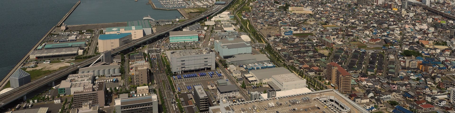 Aerial view or bird eyes view images of Kansai bay area Osaka Japan include big premium outlets located across from Kansai International Airport and it's largest airport in western Osaka bay Kansai