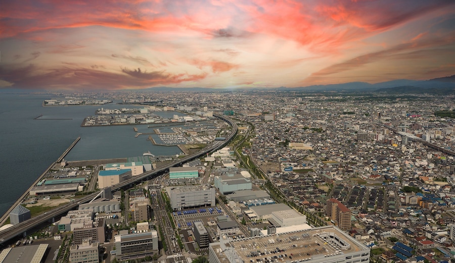Aerial view or bird eyes view images of Kansai bay area Osaka Japan include big premium outlets located across from Kansai International Airport and it's largest airport in western Osaka bay Kansai