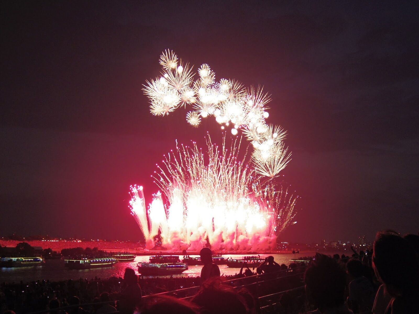 The firework festivals always start with a bang.

The Ichikawa Shimin Noryo Firework Festival (also known as Edogawa Firework Festival from the otherside of the river) is one of the most popular and largest firework festivals in the greater Tokyo area, launching 14 thousand fireworks for everyone to enjoy. 

Every year they bringing in a crowd of approx. 490 thousand people on the Ichikawa side of the river (Chiba), and another 900 thousand people on the Edogawa ward side (Tokyo). So it's pretty crowded but completely worth it if you like festivals, fireworks, and/or have never seen either in Japan before!

But even if you miss this one (first Sat of August every year), in the summer there are firework festivals in various places around the greater Tokyo area (and other cities throughout Japan) every weekend, so just find one that fits your schedule and enjoy! :)

Closest station to the Ichikawa side of the river: Ichikawa Station on the JR Sobu line