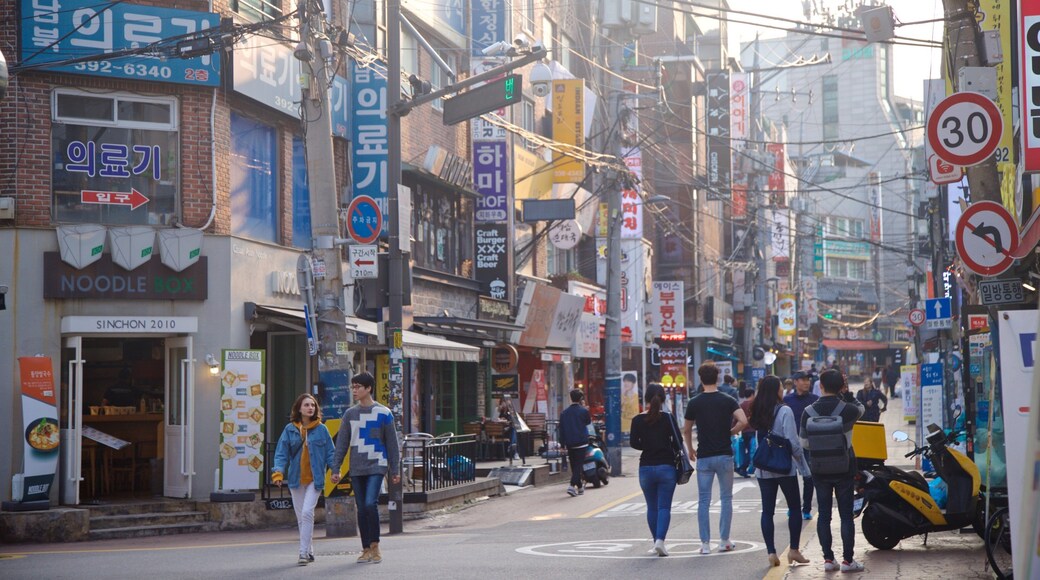 Seodaemun-gu showing a city and street scenes as well as a couple