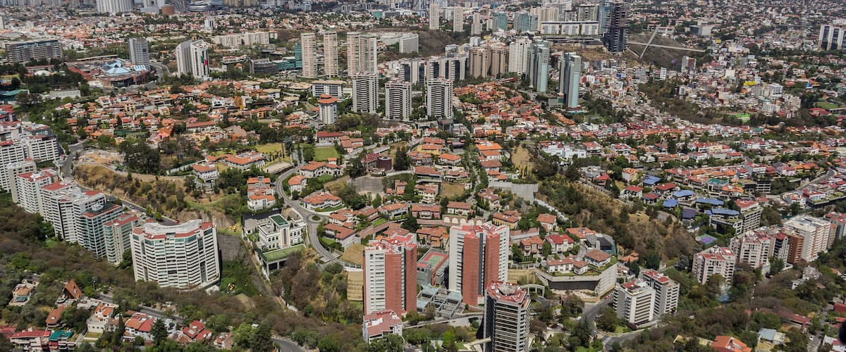Aerial view of Mexico City flying over a modern, new expensive, and exclusive living, commercial and financial area