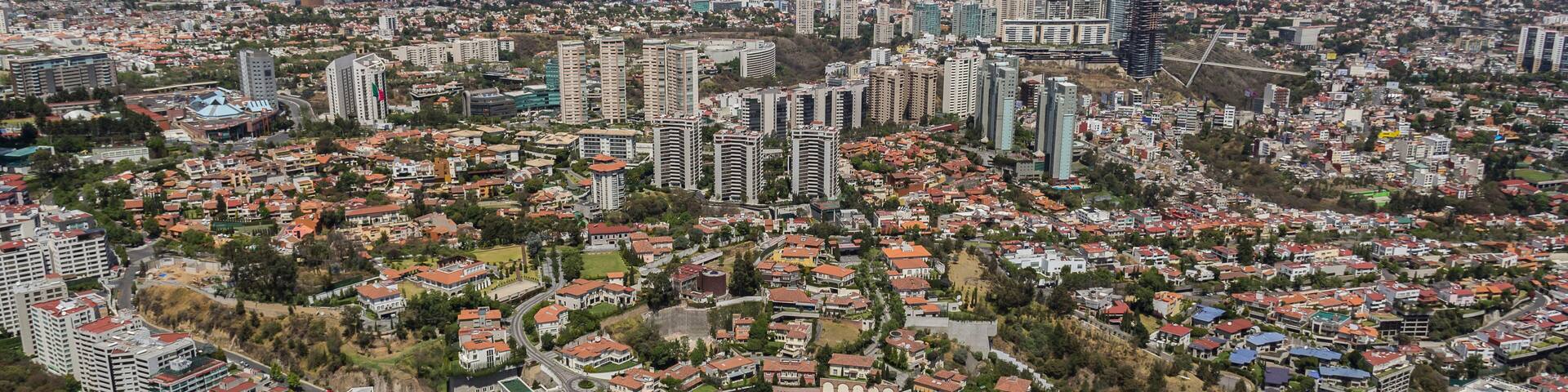 Aerial view of Mexico City flying over a modern, new expensive, and exclusive living, commercial and financial area