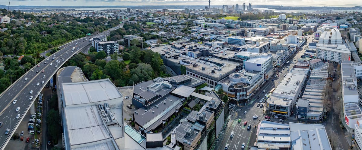 Aerial: Newmarket motorway overpass and retail stores, Auckland, New Zealand
