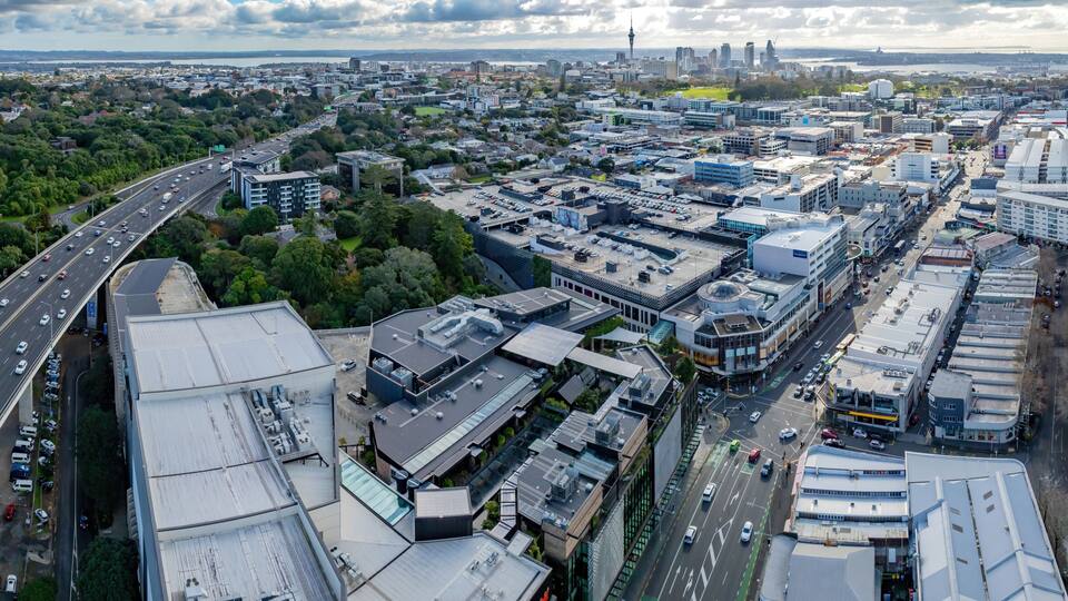 Aerial: Newmarket motorway overpass and retail stores, Auckland, New Zealand
