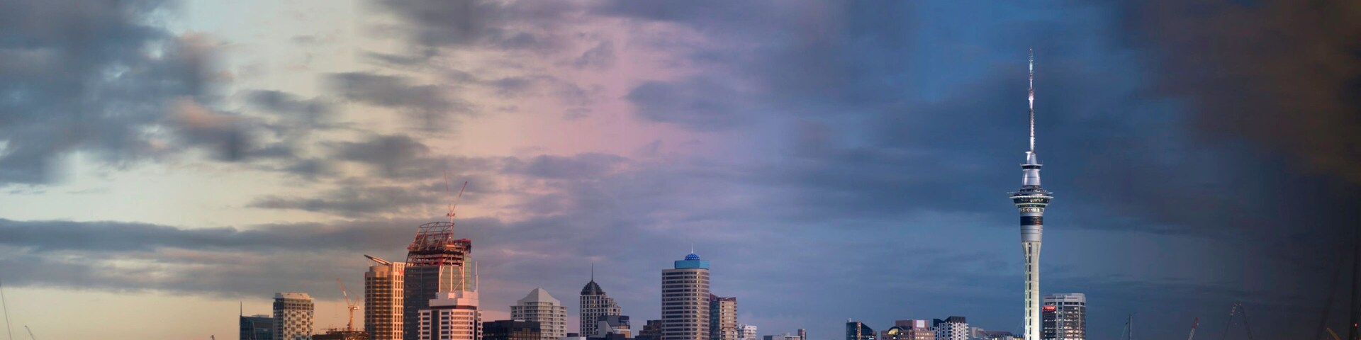 Day to night time slice of the Auckland City skyline running from the afternoon, through sunset, to early evening. View from Northcote Point, across the Waitemata harbour to Auckland, New Zealand.
