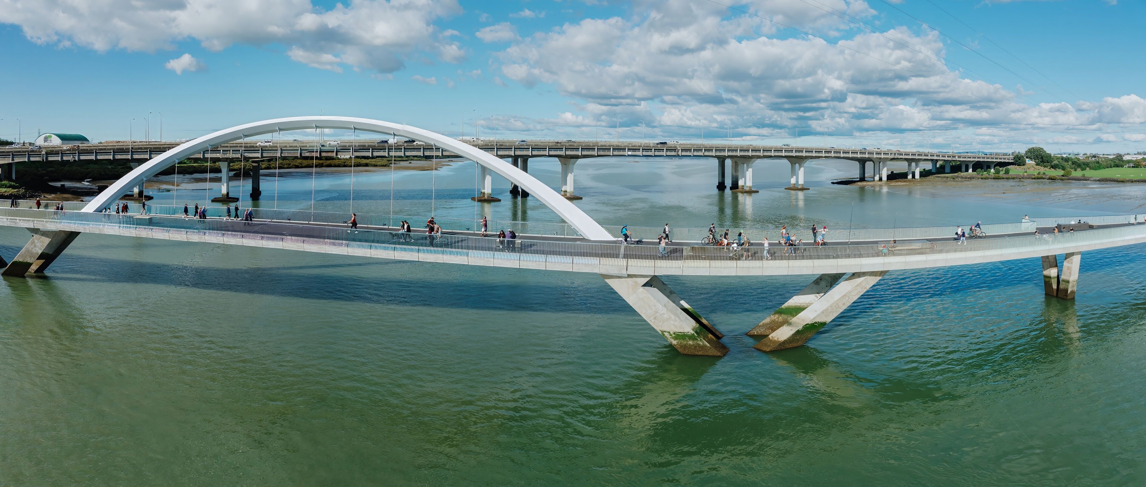 People on the Nga Hau Mangere Bridge in the Manukau Harbour, Mangere, Auckland, New Zealand.