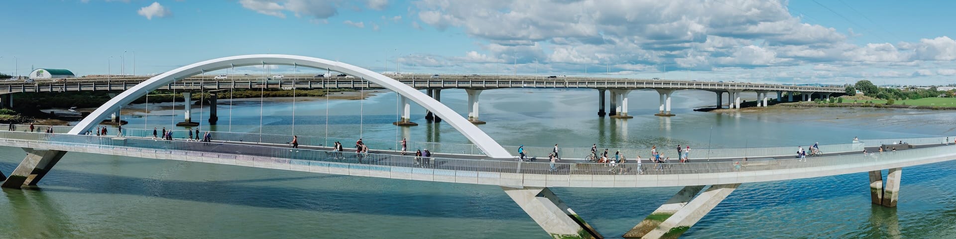People on the Nga Hau Mangere Bridge in the Manukau Harbour, Mangere, Auckland, New Zealand.
