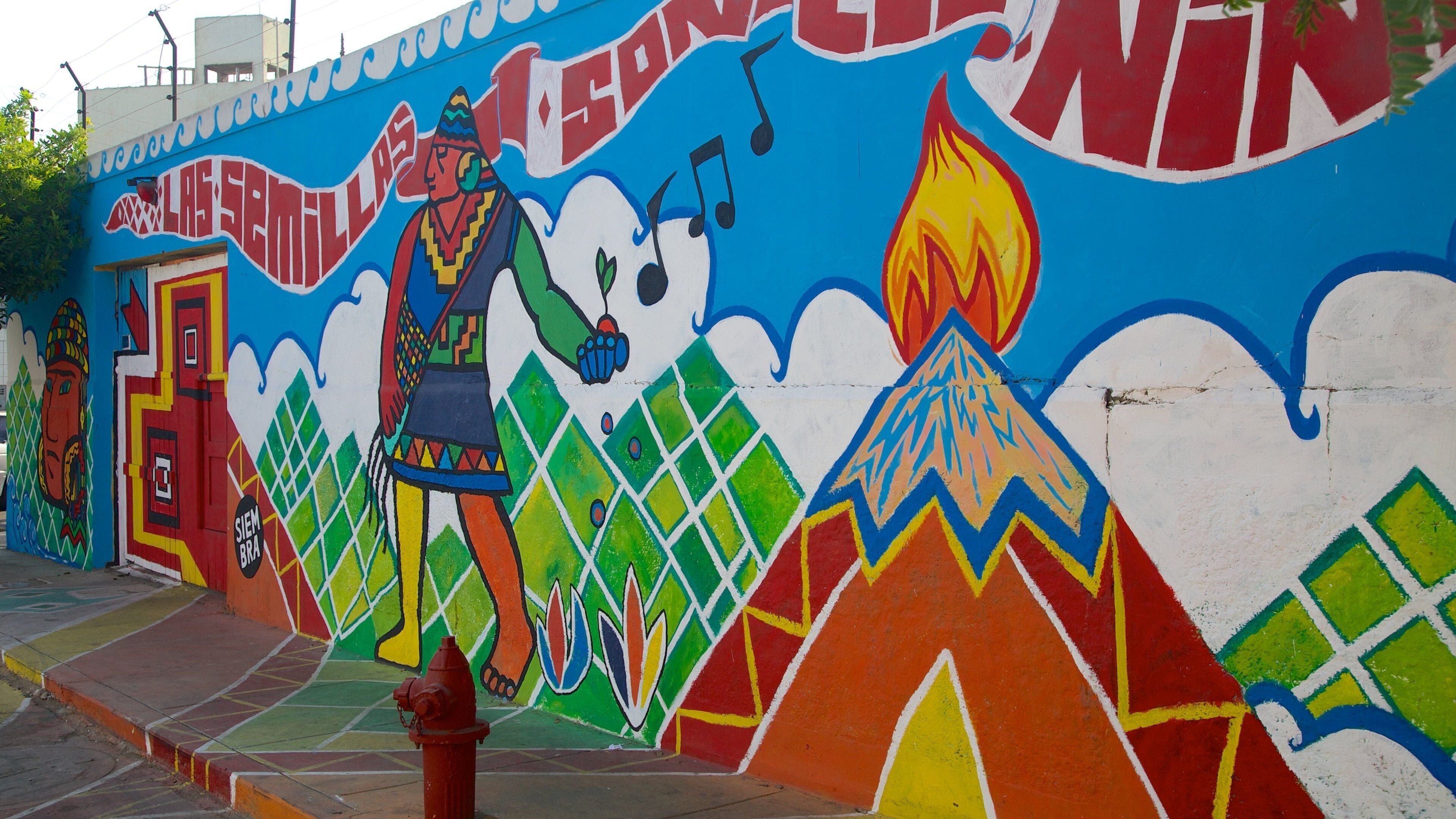 Un mural colorido con una figura, notas musicales y una llama.