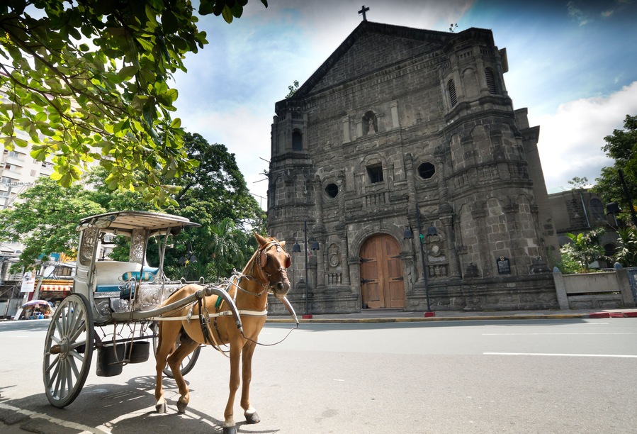 Horse Drawn Carriage parking in front of Malate church, Manila Philippines