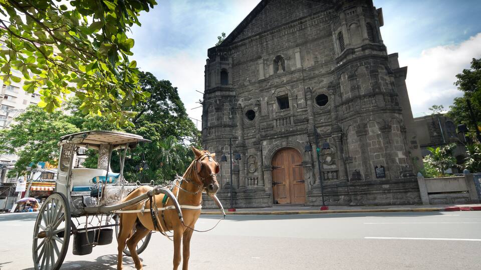 Horse Drawn Carriage parking in front of Malate church, Manila Philippines