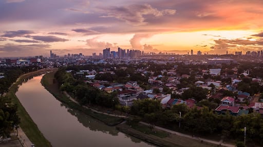 Scenic Drone Aerial Picture of the Marikina River and the Skyline of Eastwood City during Sunset in Metro Manila, Philippines