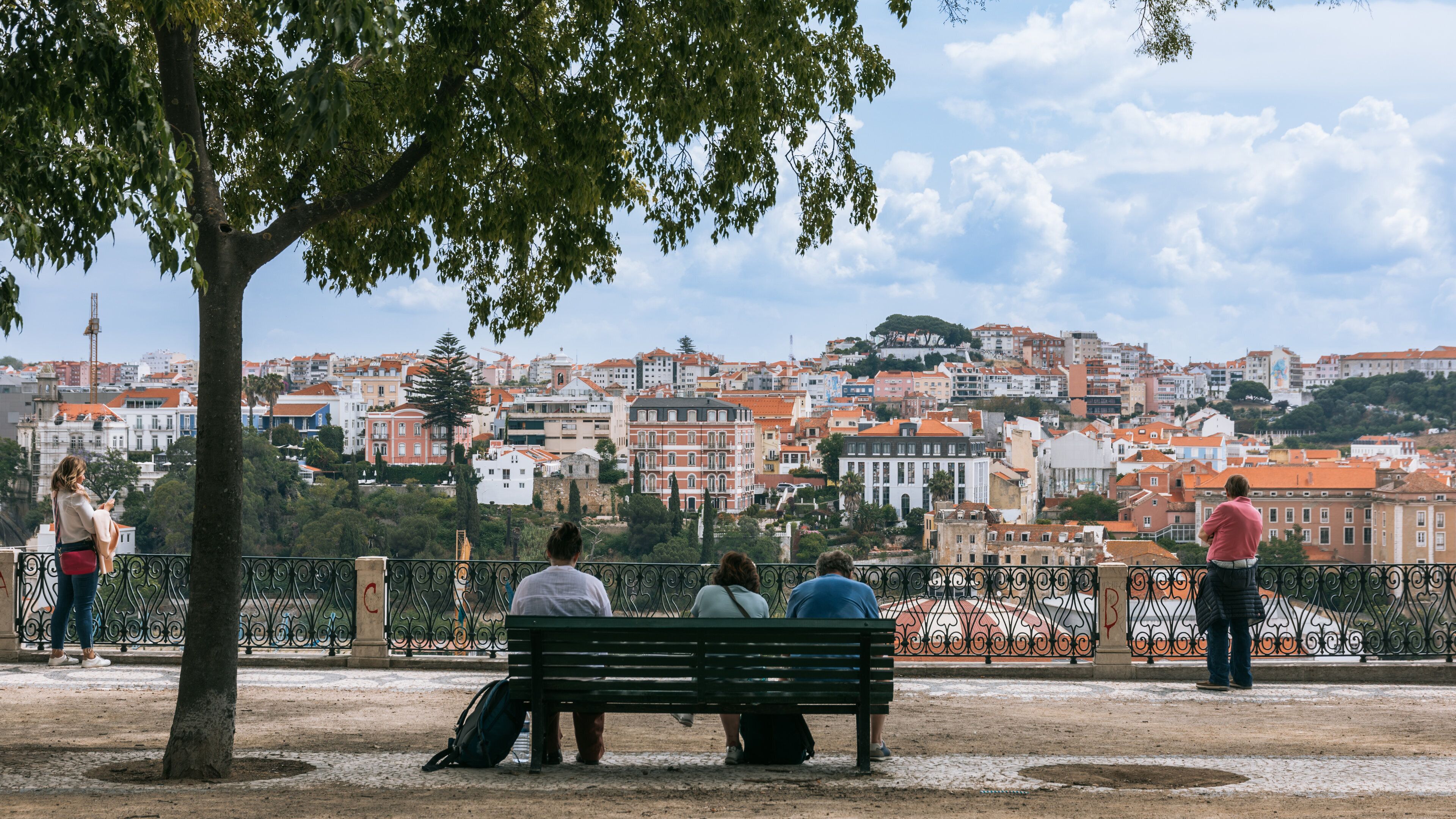 Bairro Alto featuring a city and views as well as a small group of people