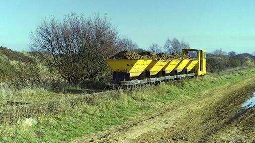 Supplies by rail for Star Lane brickworks Five skips of brickearth are propelled towards the works from the stockpiles. Actual digging of clay seemed to have finished at this date, but there were enormous stockpiles some distance from the works. Five skips were standard here, but at the same company's Cherry Orchard Lane works three was usual, despite both lines being practically level and with similar locomotives.