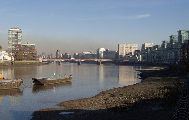 Vauxhall Bridge from the south-west Old barges lend a slightly Dickensian touch to this reach of the river past Nine Elms Lane. On the right are buildings around Vauxhall Cross. Seen from Elm Quay Court. On the left is Rivermill House, on the Pimlico side of the river.