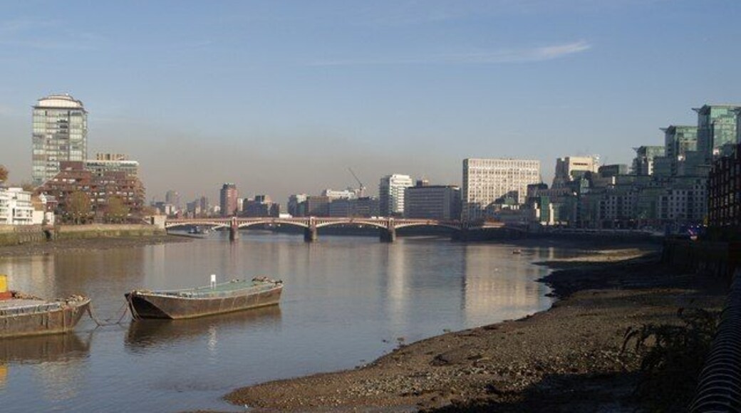 Vauxhall Bridge from the south-west Old barges lend a slightly Dickensian touch to this reach of the river past Nine Elms Lane. On the right are buildings around Vauxhall Cross. Seen from Elm Quay Court. On the left is Rivermill House, on the Pimlico side of the river.