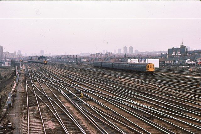 Clapham Junction - fan of tracks toward London 1979 The maze of trackwork at Clapham Junction, photographed from the SW division signalbox which spanned the Windsor lines just outside the station. From left to right, there are: 2 tracks to any of Kensington Olympia/Victoria (Chatham side) and Wandsworth Road; 4 tracks (Windsor lines) from Twickenham to London Waterloo; 3 sidings; 4 tracks (main lines) from Wimbledon to Waterloo on which the all-blue train is travelling and; 4 tracks from London Victoria to Brighton.