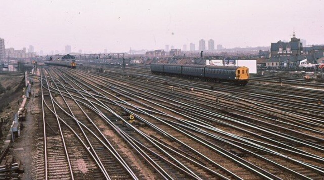 Clapham Junction - fan of tracks toward London 1979 The maze of trackwork at Clapham Junction, photographed from the SW division signalbox which spanned the Windsor lines just outside the station. From left to right, there are: 2 tracks to any of Kensington Olympia/Victoria (Chatham side) and Wandsworth Road; 4 tracks (Windsor lines) from Twickenham to London Waterloo; 3 sidings; 4 tracks (main lines) from Wimbledon to Waterloo on which the all-blue train is travelling and; 4 tracks from London Victoria to Brighton.