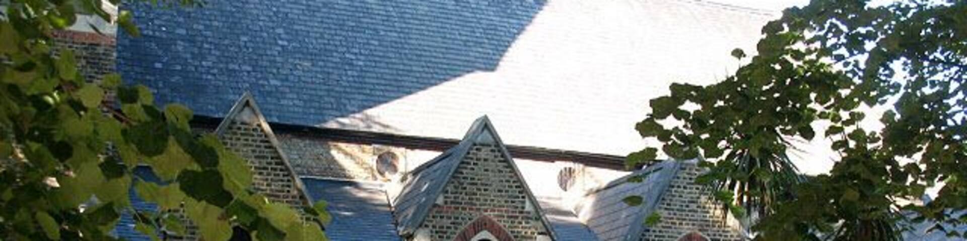 St Anne's church, Bermondsey - south side. It is difficult to photograph this church because of trees all round it. For another view see 1449457. It was built in 1872.