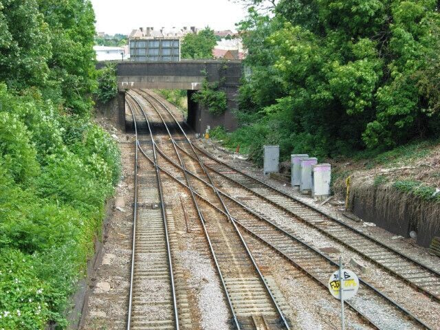 Junction Road Junction This railway location takes its name from Junction Road which crosses the bridge in the picture. The line from the right is a freight only connection from the Midland Main Line, which joins the Tottenham & Hampstead Line here. There is a passenger service between Gospel Oak and Barking.
