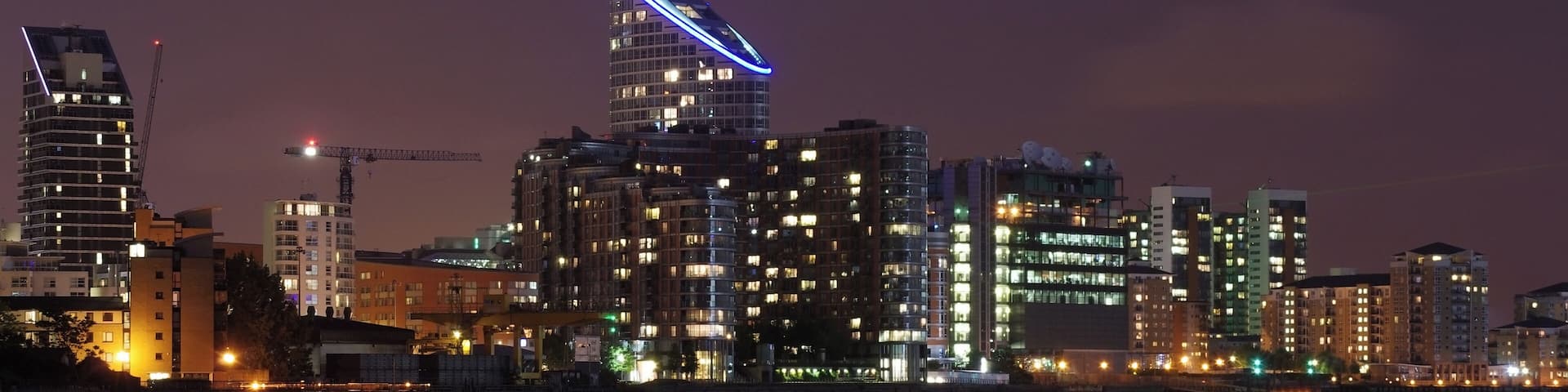 Ontario Tower and New Providence Wharf seen from the banks of the Thames near Galleons View.