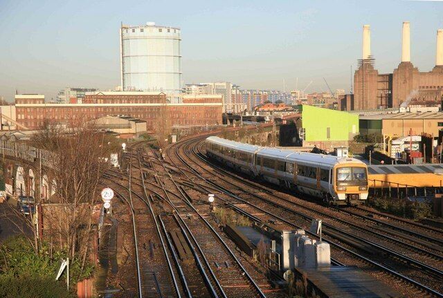 Busy junction A train from Victoria heads south. The former Battersea power station can be seen on the right. Stewart's Lane maintenance depot is in the left distance. The junction to the left is known as Factory Junction.