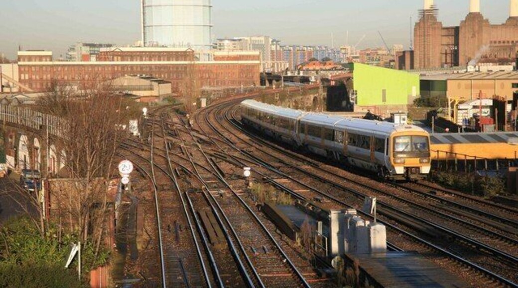 Busy junction A train from Victoria heads south. The former Battersea power station can be seen on the right. Stewart's Lane maintenance depot is in the left distance. The junction to the left is known as Factory Junction.