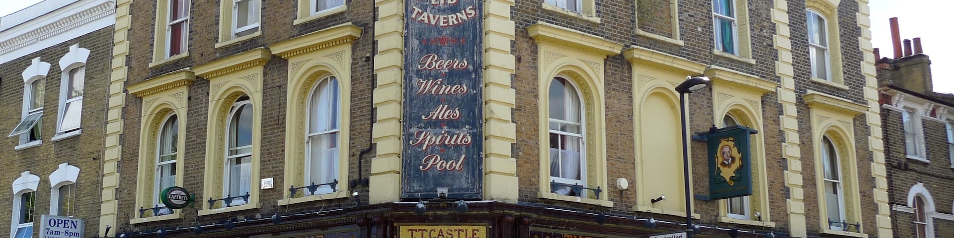 A beautifully-tiled pub between Brixton and Stockwell. The name over the door is the publican at the time this was tiled in the 1880s (Theodore Castle). (View of side.) Address: 49 Dalyell Road. Owner: Conway Taverns. Links: Urban 75 Dead Pubs (history)