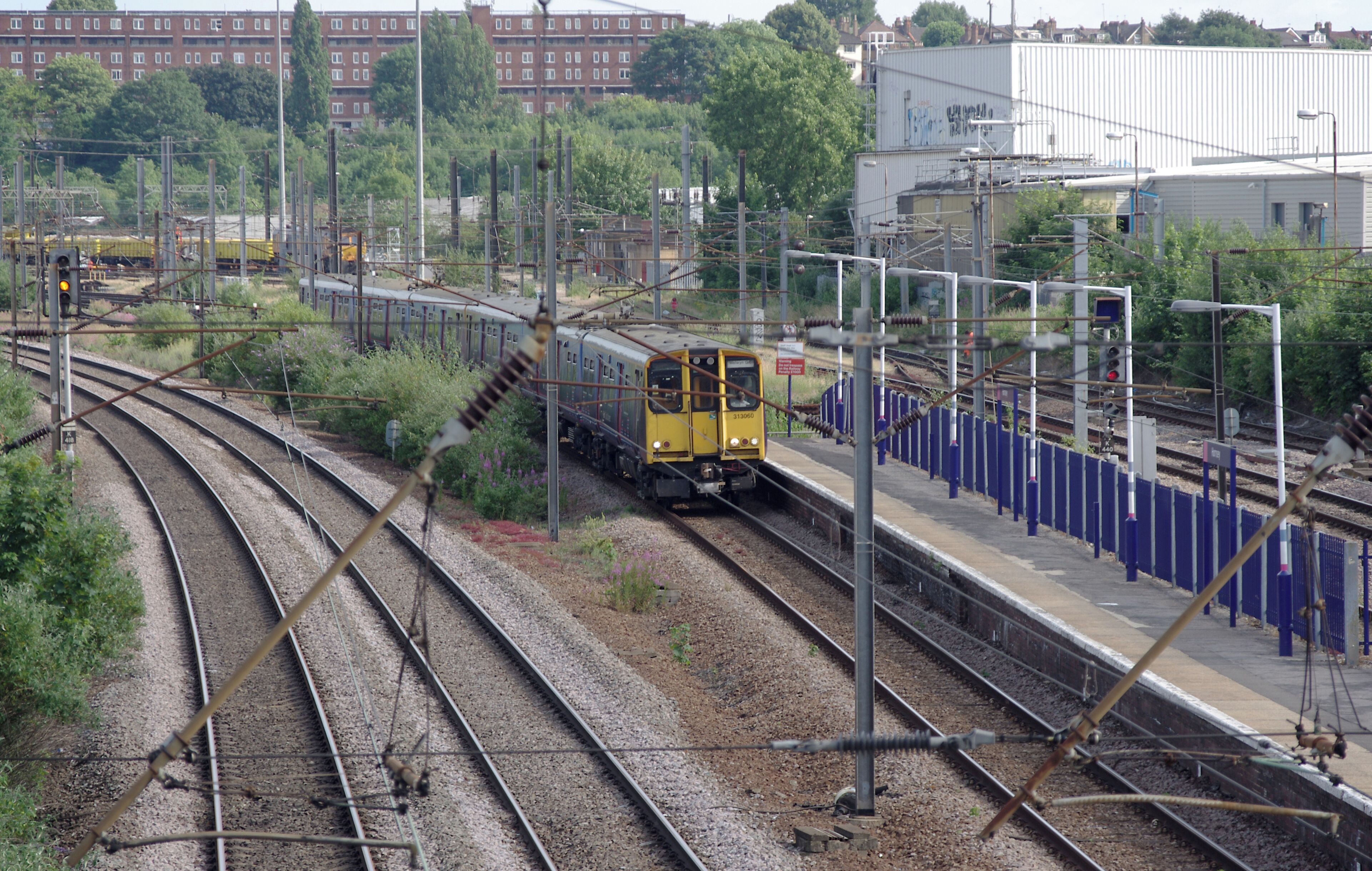 First Capital Connect 313060 arrives at Hornsey with a northbound service.