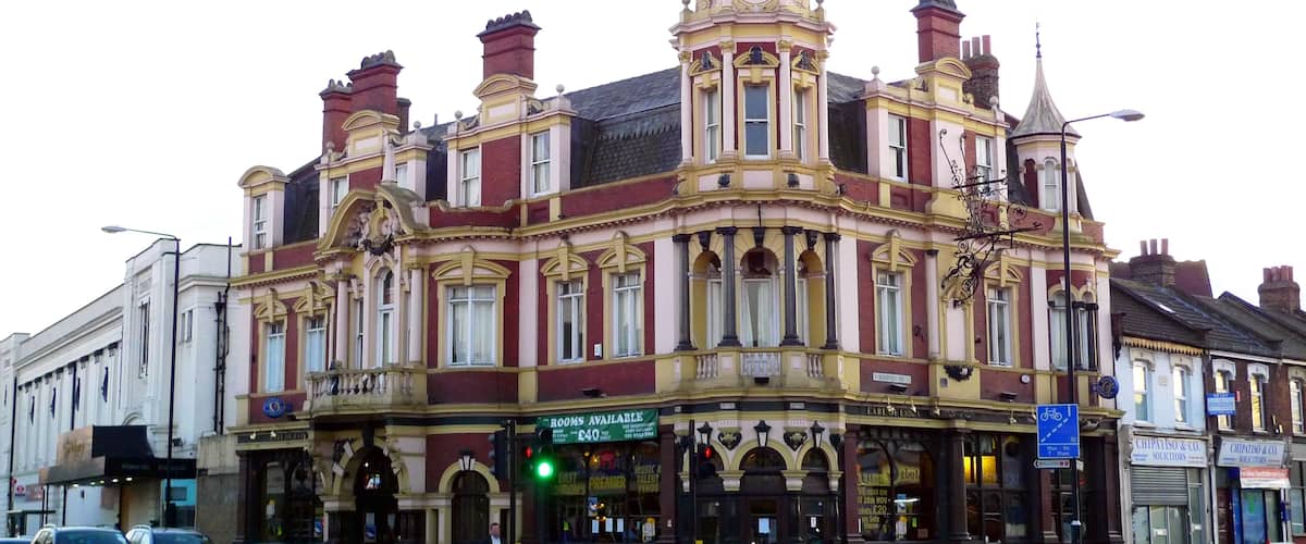 A grand pub building on a busy intersection. There's some nice ironwork on that hanging sign. Address: 616 Romford Road. Owner: Courage (former). Links: Beer in the Evening Dead Pubs (history)
