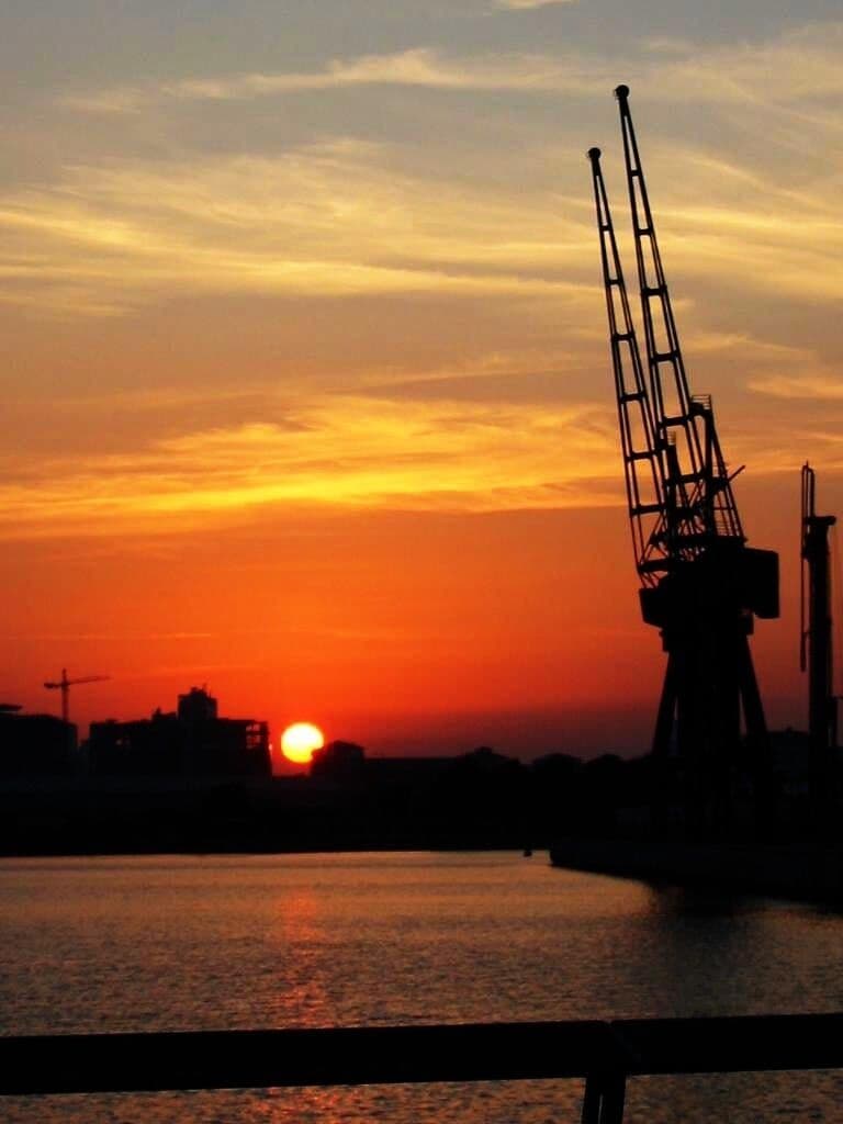 Reuters Meridian building and RVD cranes salute the evening sun