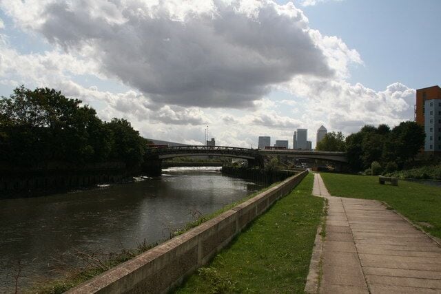 View South along the Old River Lee In the distance the iconic Canary Wharf tower is seen.