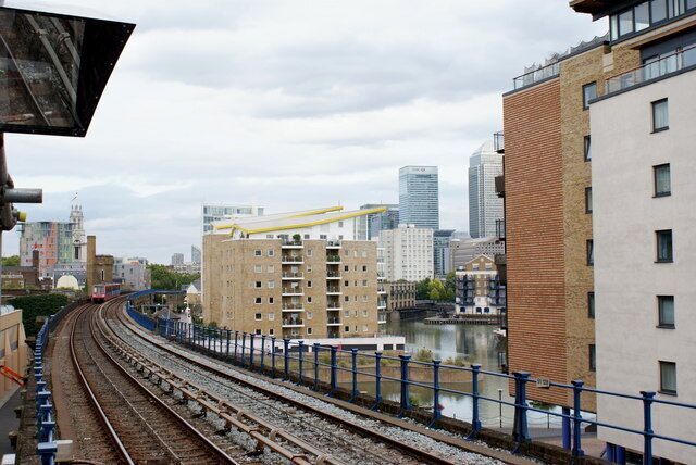The Train Just Departed View from the DLR Limehouse station, as the train departs for East London. Limehouse basin can be seen to the right of the railway, and Canary Wharf is in the distance.