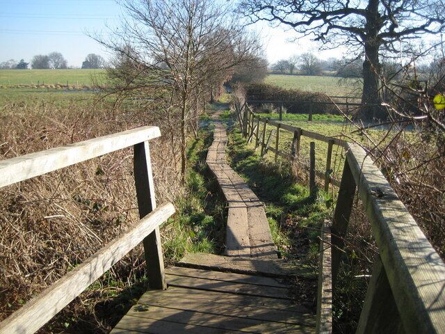 Send Marsh: Footpath towards Ripley Taken from the footbridge over East Clandon Stream the footpath crosses a boggy part of the valley here, hence the need for a boardwalk.