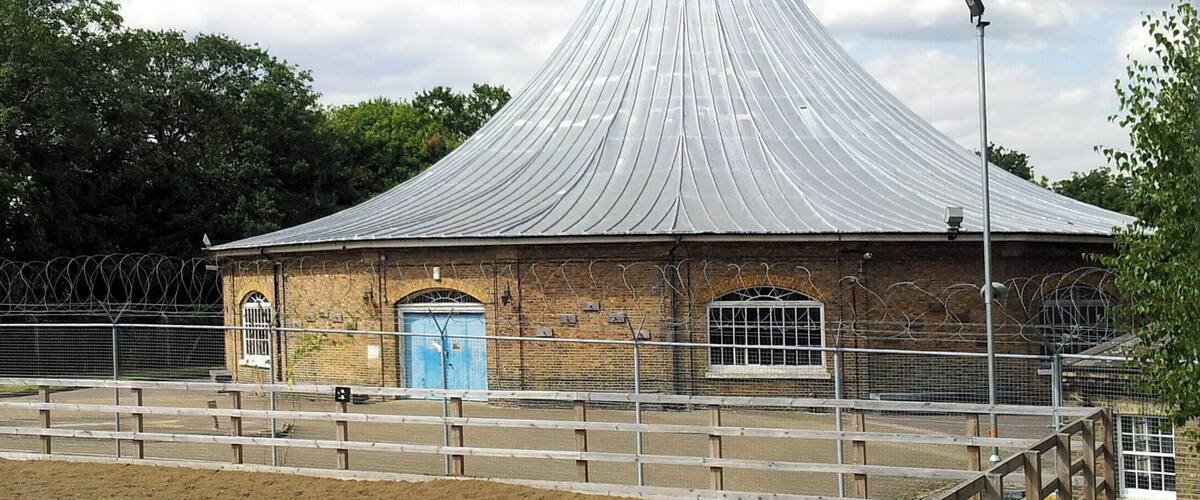 View of the Rotunda, designed by John Nash for St. James's Park in 1814 and moved to Woolwich Common in 1820 to serve as the Royal Artillery Museum (until 2001), Green Hill, Woolwich, Southeast London. In the foreground a horse corral used by the King's Troop, Royal Horse Artillery, based in the adjacent Napier Lines Barracks.
