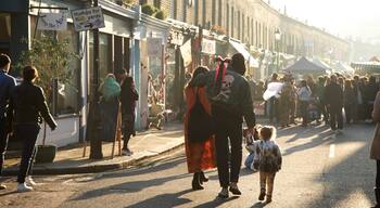 London featuring markets and street scenes as well as a family