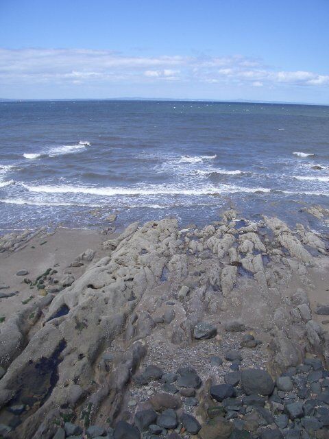 Shoreline at Joppa Looking north across the Firth of Forth towards Fife.