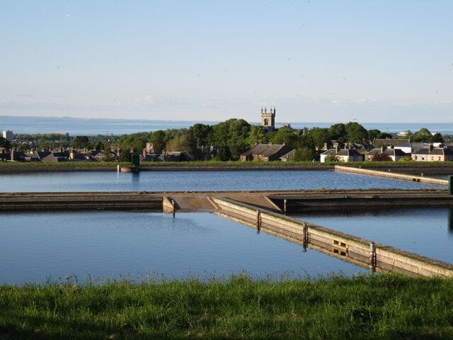 Alnwickhill Waterworks Alnwickhill Filterbeds with Liberton Kirk tower in the background. When each pond is emptied the slipways allow machinery onto the sand filter bed to scrape away the top layer of dirty filter material.