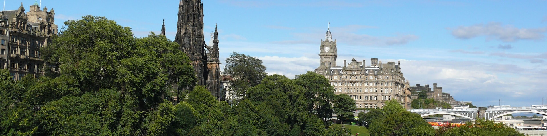 East Princes Street Gardens in Edinburgh. Princes Street Gardens is a public park in the centre of the city. To the left is the Scott Monument in the middle the Balmoral Hotel (formerly the North British) and to the right the North Bridge.