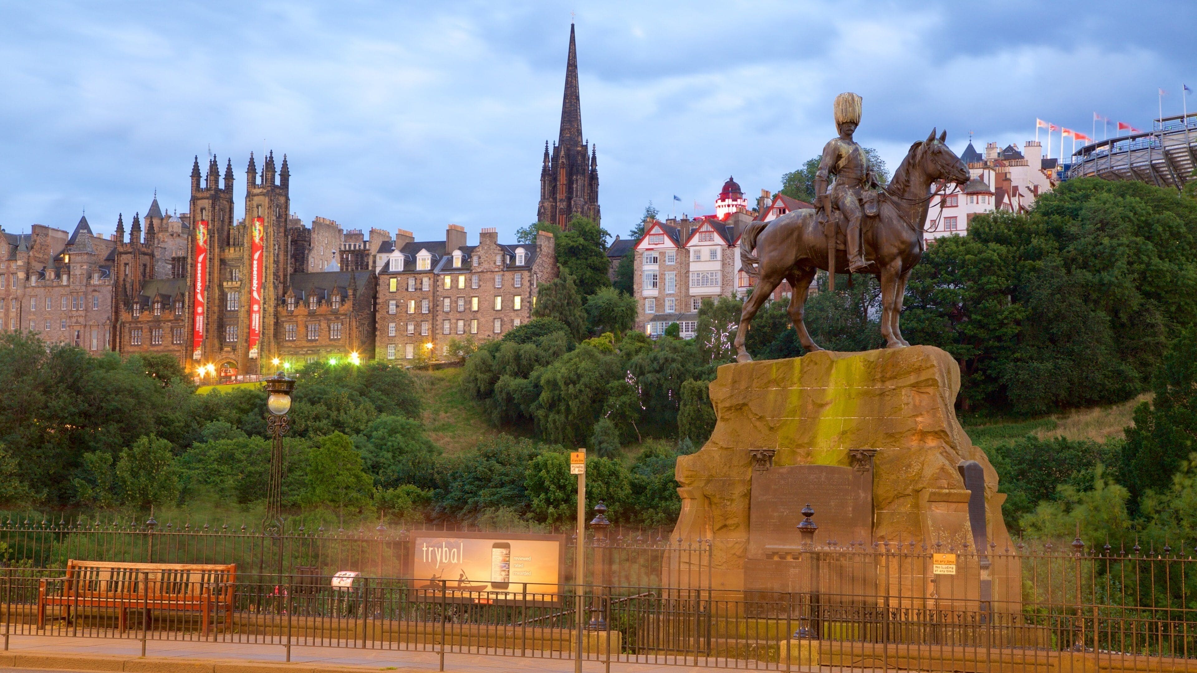 Edinburgh showing a statue or sculpture and night scenes