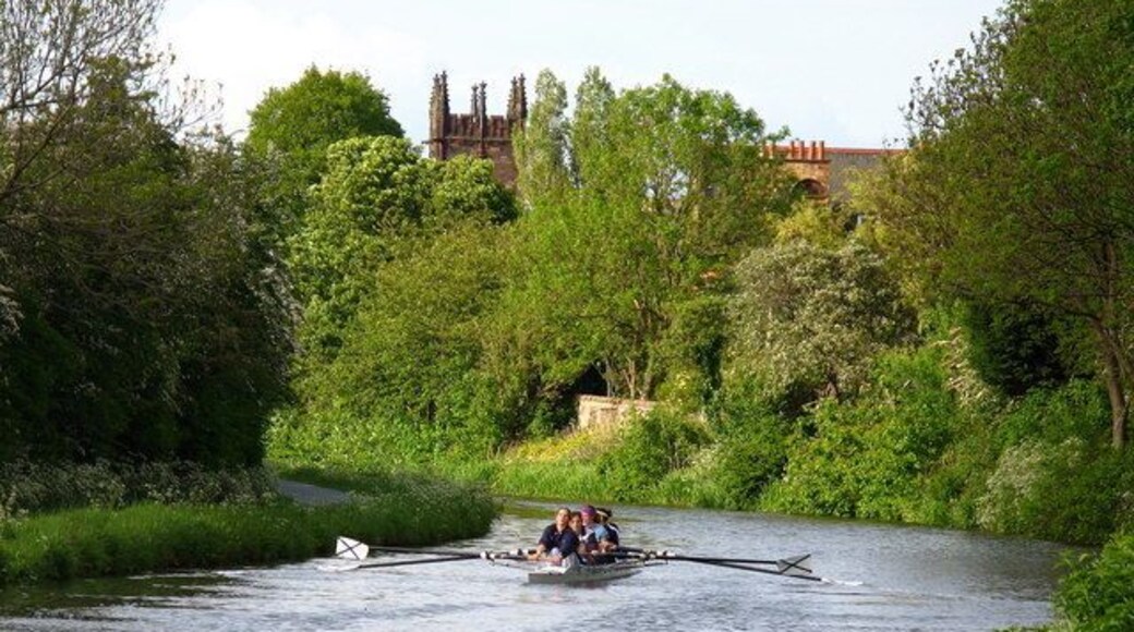 Union Canal, Merchiston In the early evening sun a boat from St Andrew Boat Club was out training on the canal. Polwarth Parish Church is also visible. This was originally a Free Church and is now Church of Scotland. The original design for the tower by Sidney Mitchell & Wilson included a spire but was later changed by James Jerdan & Son.