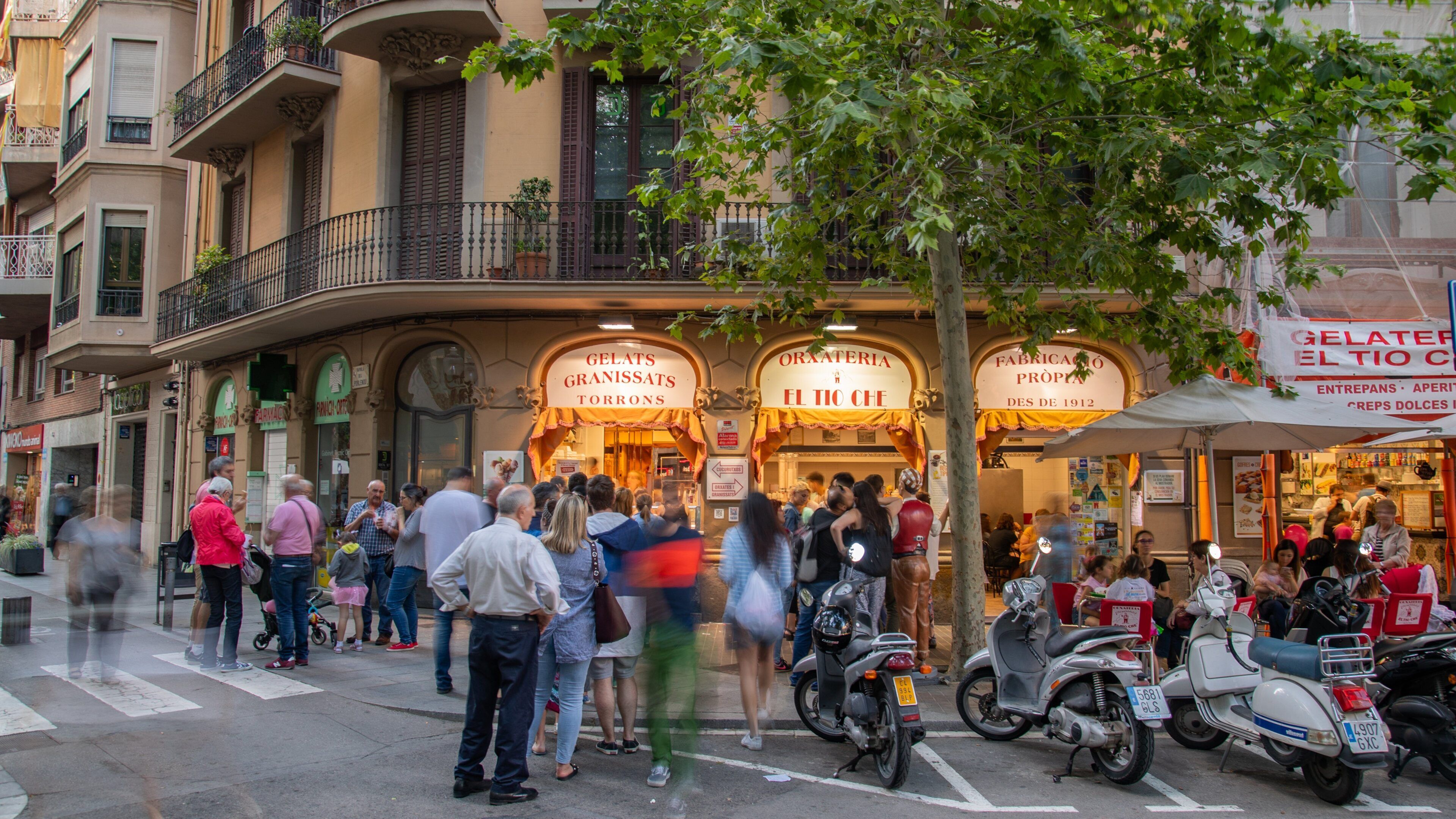 Poblenou showing street scenes as well as a small group of people